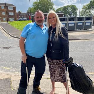 St Leger staff posing for photograph with litter pickers