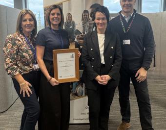 Staff posing with Customer Excellence Accreditation