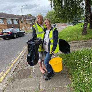 St Leger staff posing for photograph with litter pickers