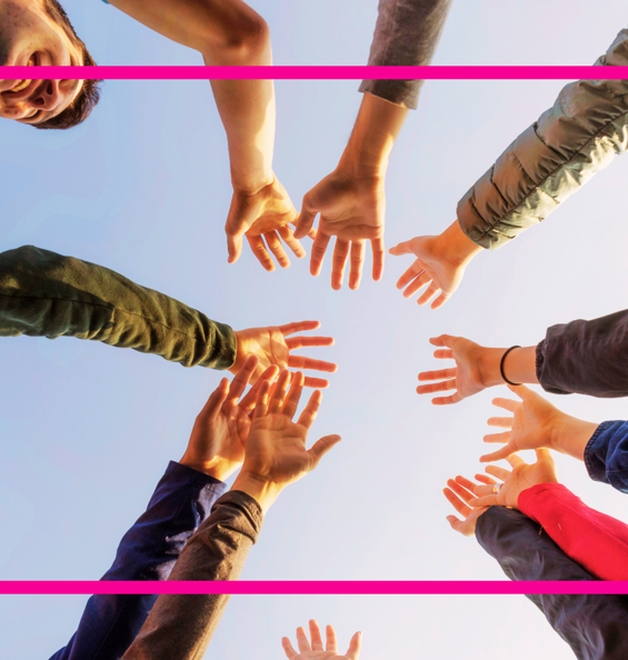 Group of people with hands in a circle